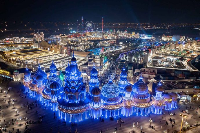 Global Village pavilions lit up at night