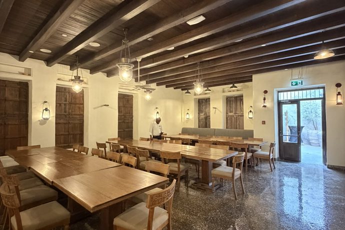 Long wooden tables set for dinner